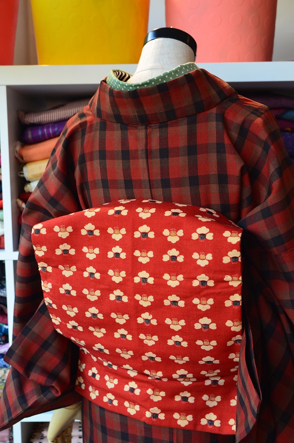 ツバキ柄の草木染紬名古屋帯【全長321cm】