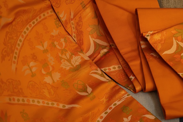 ゆらぎオレンジの花唐草模様九寸名古屋帯【全長358.5cm】 